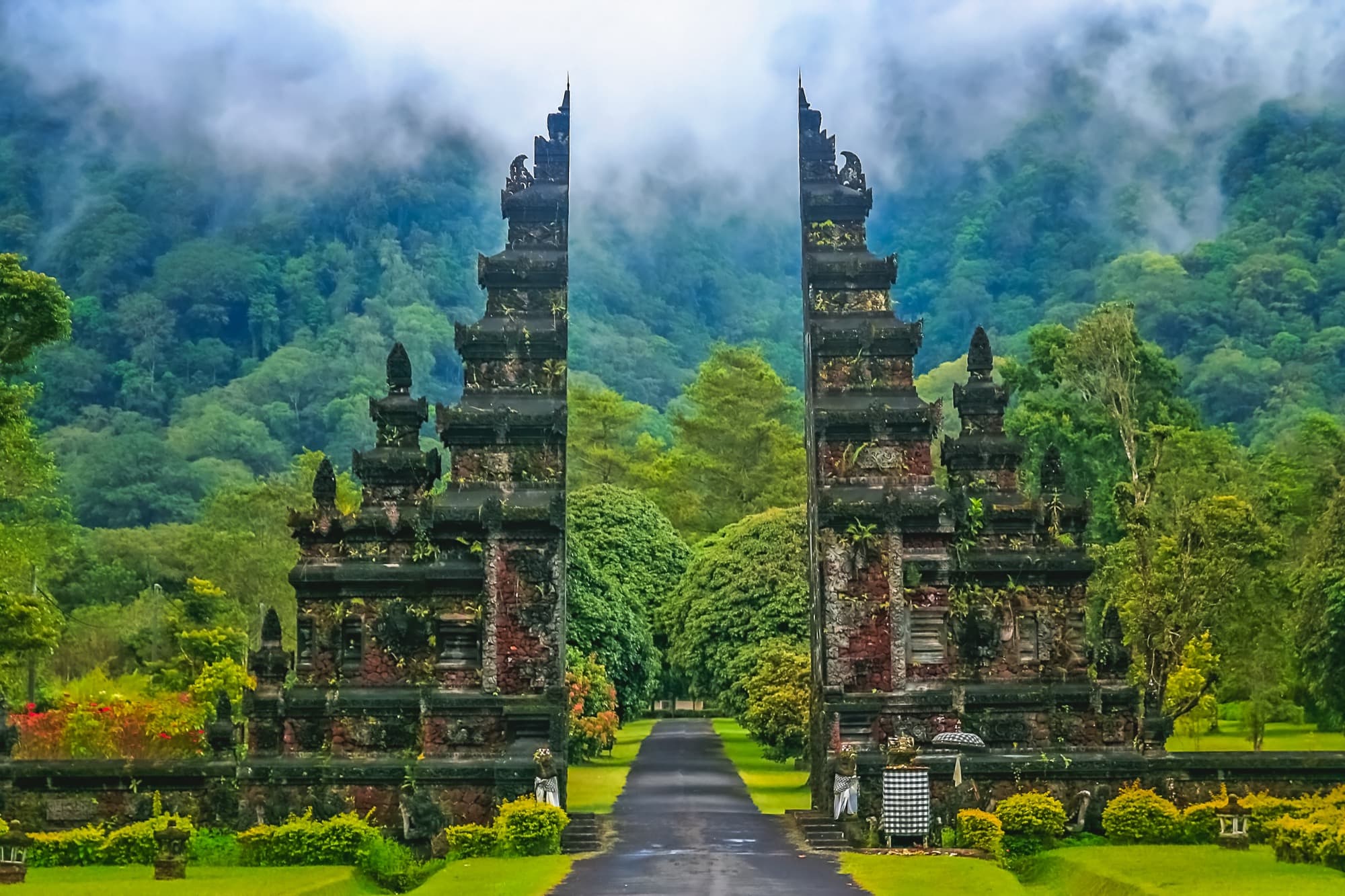 Carved temple gates in a Bali forest