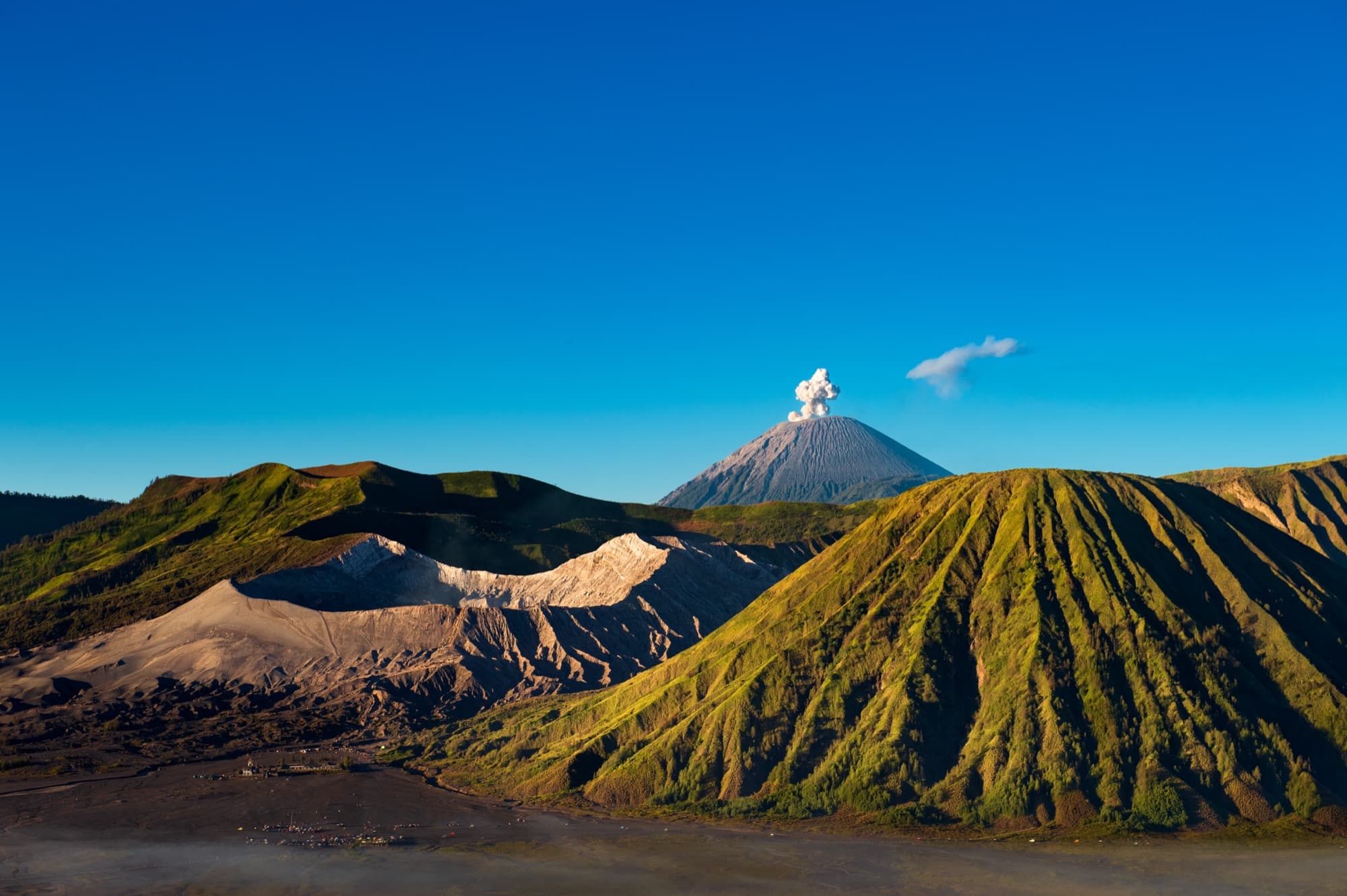 Volcano over green highlands in Bali
